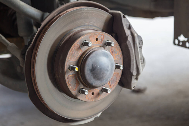 Closeup of car disc brake at car workshop-Technical concept - Photo, Image