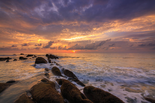 Amazing twilight Sunset seascape with sea wave hitting the green moss at Kuala Penyu, Sabah, Borneo. Image may contain soft focus and blur due to long exposure. - Fotografie, Obrázek