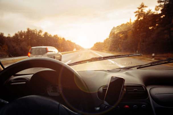 interior view of  car driving on road at sunset  - Foto, Imagem