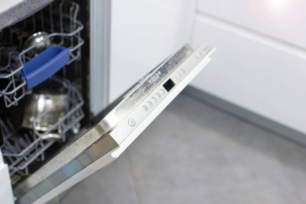 view of new modern opened dishwasher in kitchen - Φωτογραφία, εικόνα