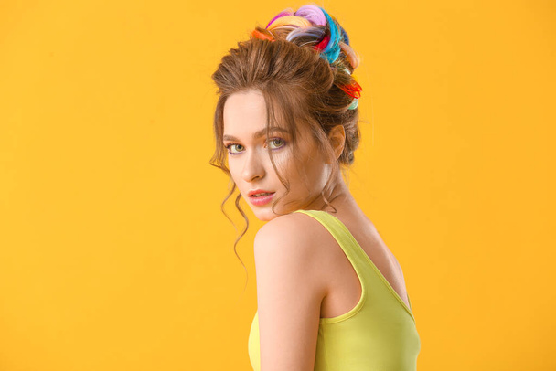 Beautiful young woman with unusual hair on color background - Фото, изображение