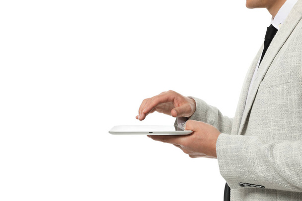 Businessman using tablet computer on white background, closeup - Photo, Image