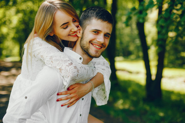 elegant couple in a forest - Photo, image