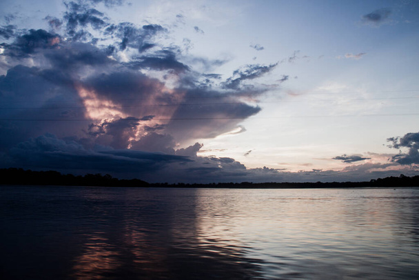 sunset on the Napo river in the amazon, stunning colors, Ecuador - Photo, Image