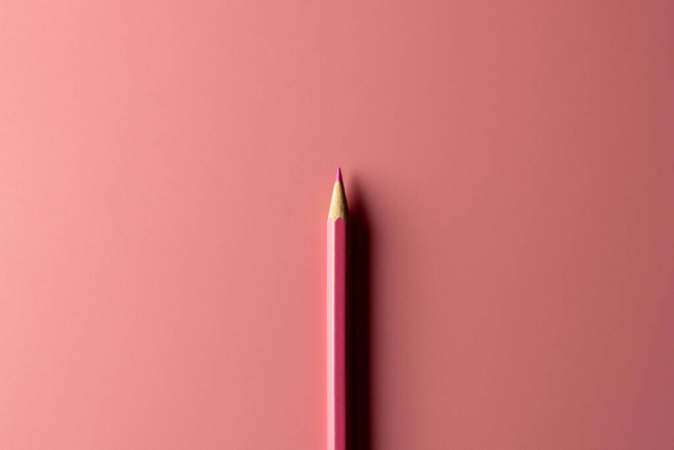 pink crayon pencil on pink paper background. - Business concept - Fotoğraf, Görsel