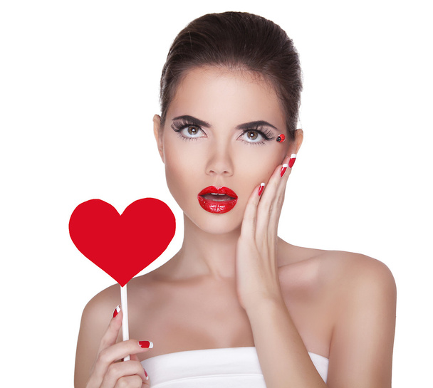 Beautiful surprised woman with glamour bright makeup holding red - Φωτογραφία, εικόνα