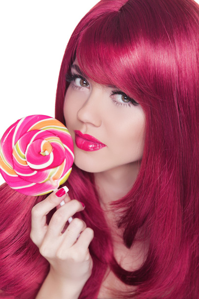 Beauty Girl Portrait holding Colorful lollipop. Glamour makeup. - Фото, изображение
