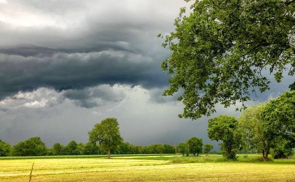 The coming of a big storm, tempest or hurricane over the countryside landscape.  - Photo, Image