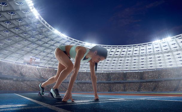 Female athlete on professional athletics stadium. - Photo, Image