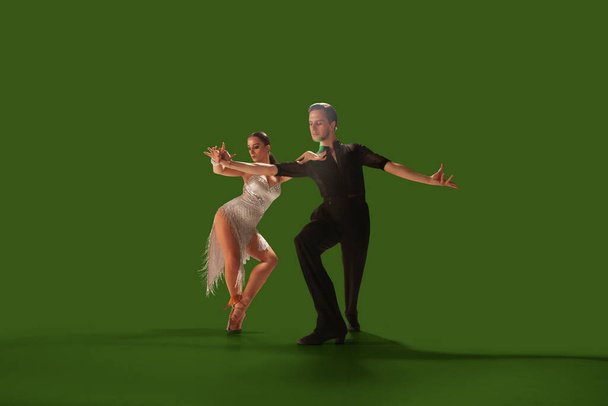Couple dancers  perform latin dance on wgreen screen background. - Photo, Image