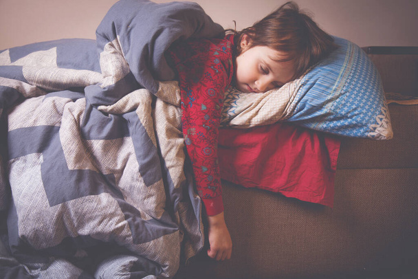 Llittle beautiful young girl sleeping in bed. Horizontal image. - Photo, Image