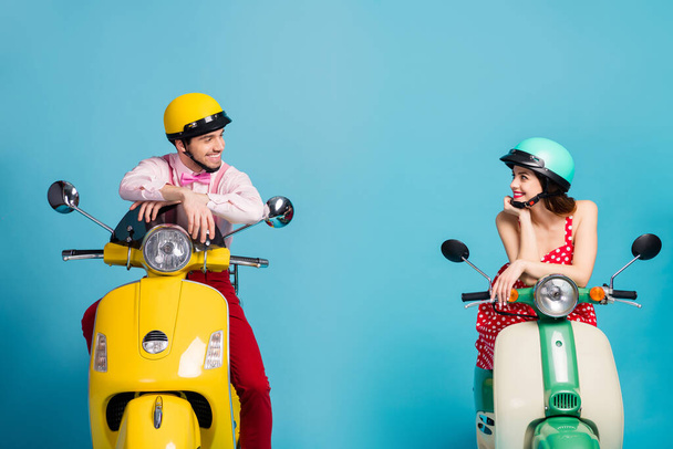 Portrait of his he her she nice attractive lovely cheerful cheery couple sitting on moped wearing festal look communicating isolated on bright vivid shine vibrant blue color background - Foto, Imagen
