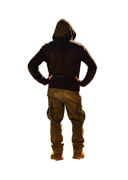 Back view man with arms akimbo wearing hoodie and trouser isolated photo - Foto, Imagem