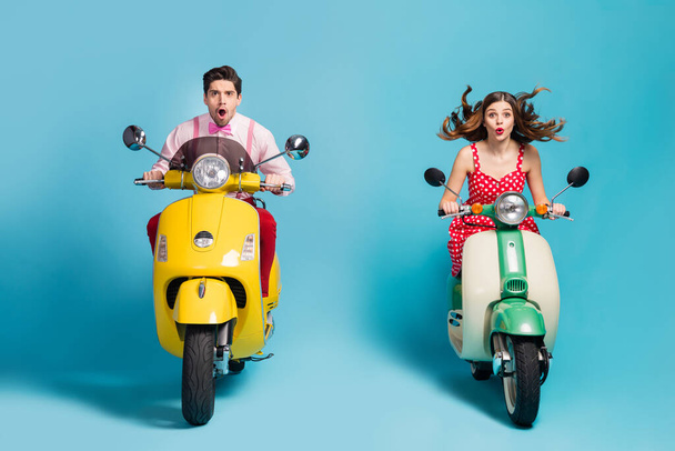 Portrait of his he her she nice attractive lovely cheerful cheery funny shocked guys driving moped tour having fun fast speed isolated over bright vivid shine vibrant blue color background - Fotoğraf, Görsel
