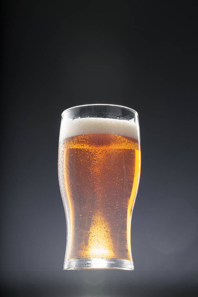 Glass of beer on black background, copy space - Фото, зображення