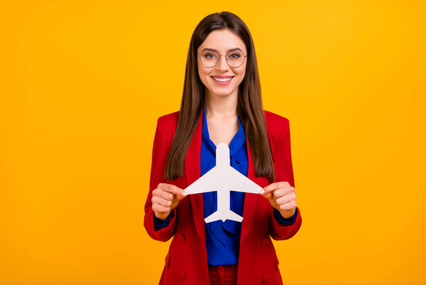 Photo of classy attractive business lady successful worker planning airplane trip on vacation wear specs red luxury office blazer blue blouse suit isolated yellow color background - Φωτογραφία, εικόνα