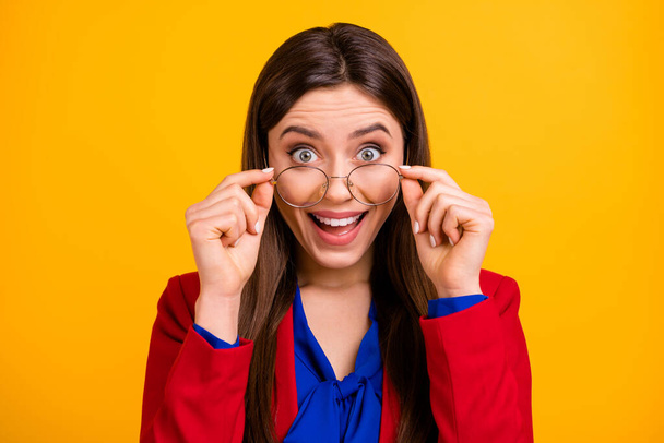 Close up photo of astonished crazy girl executive marketer touch specs impressed incredible promo wear suit isolated over shine color background - Фото, изображение
