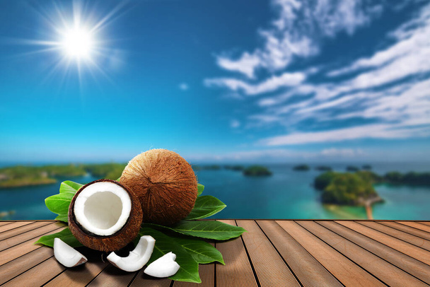 open fresh coconuts poster with blurry island background - Photo, Image