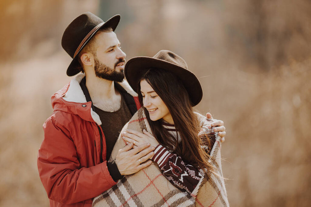 13.07.2018 Yaremche, Ukraine: loving couple, stylish bearded man and attractive woman cuddling on a walk - Zdjęcie, obraz