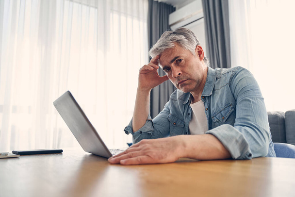 Adult grey haired man spending time at home - Photo, Image