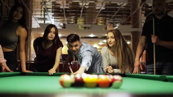 Friends joyfully play billiards. - Footage, Video