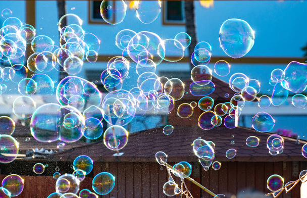 Background with many soap bubbles in air on city street, outdoor fun for everyone
 - Фото, изображение