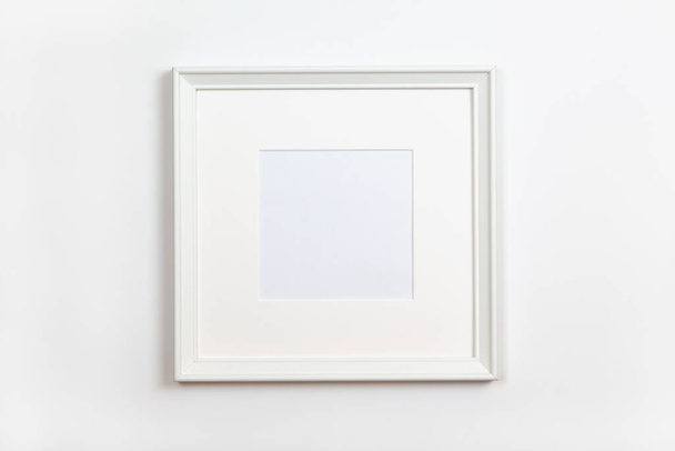 White clean square frame with passepartout on white background, copy space. Flat lay or side view, minimal style mock-up. For gift shop, social media, website design - Photo, image