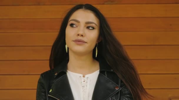 Portrait of beautiful caucasian or latin woman with dark long hair, wide smile and romantic emotions. Woman is flirty and inspired.  - Video