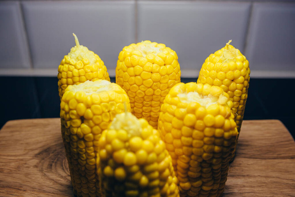 Boiled sweet corn close-up on the table before eating - 写真・画像