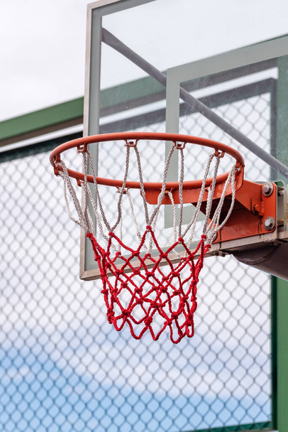 Basketball ring with a net for playing basketball outdoors, basketball hoop - Fotografie, Obrázek
