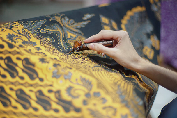 Surakarta, Indonesia - August, 7, 2020 : Canting batik background on the fabric. Drawing Batik Tulis - Photo, Image
