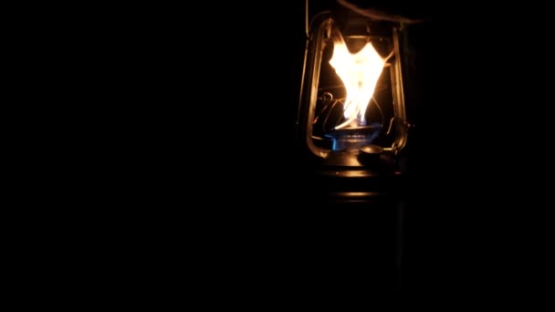 man walking in a dark corridor with a oil lamp - Materiał filmowy, wideo