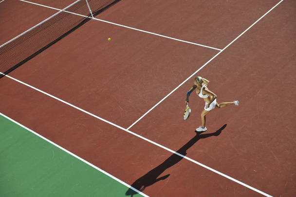 Young woman play tennis - Фото, зображення