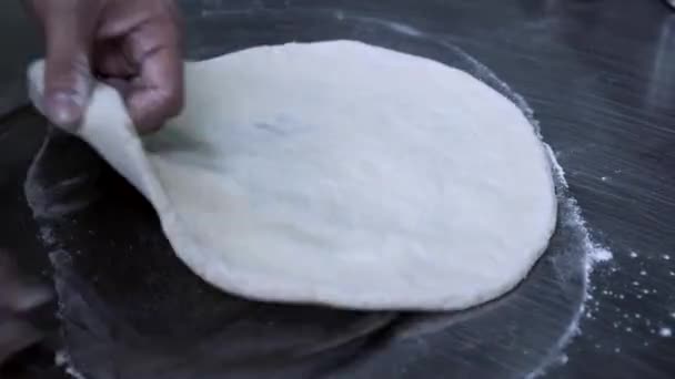 Chef cooking freshly baked assorted pizza. video. - Filmati, video