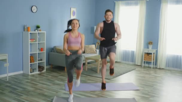 Young Happy Couple Is Running at Home - Video