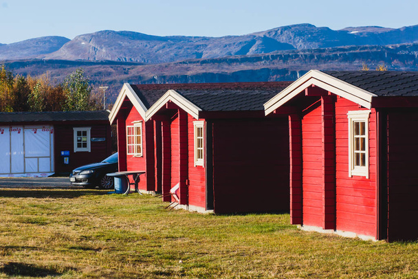 View of Classical Norwegian Camping site with traditional wooden red cottages, Northern Norwa - Photo, Image