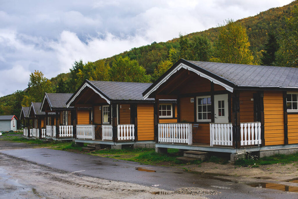 View of Classical Norwegian Camping site with traditional wooden red cottages, Northern Norwa - Foto, Imagem