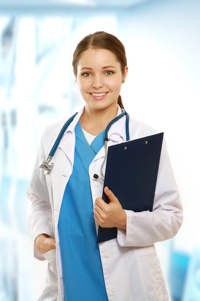 A portrait of a female doctor with a folder - Fotó, kép