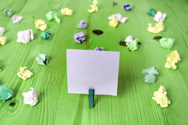 Rectangle Square Shaped Colored Paper With Clothespin Or Paper Ball In A Light Background. Colorful Crumpled Note Spread Around The Table. Office Supplies In A Desk. - 写真・画像