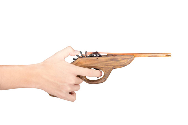 Toy gun made of wood isolated on white background - Foto, Imagem
