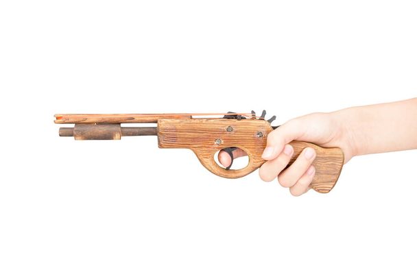 Toy gun made of wood isolated on white background - Foto, Imagem