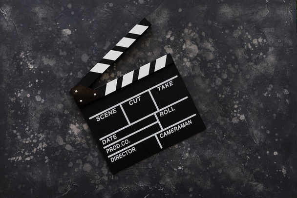 Filmmaking concept. Movie Clapperboard. Cinema begins with movie clappers. Top view. Copy space. Place for your text. - Zdjęcie, obraz