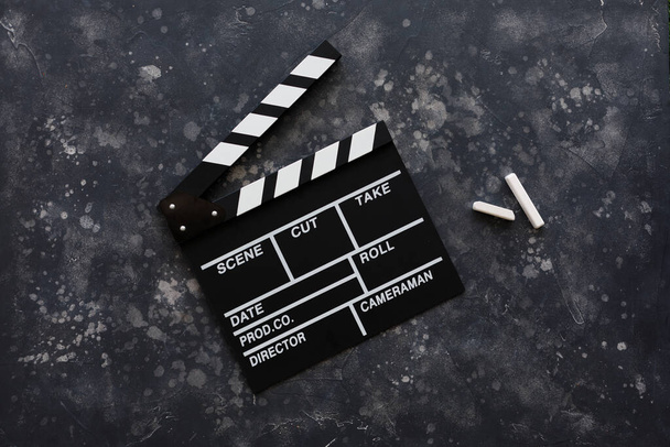 Filmmaking concept. Movie Clapperboard. Cinema begins with movie clappers. Top view. Copy space. Place for your text. - 写真・画像