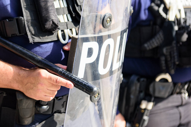U.S. police. Shield and equipment for police. Public unrest. Law Enforcement. Riot police used shields and batons tactical training. - Photo, Image