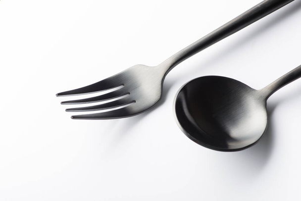black fork and spoon isolated on white background - Photo, Image