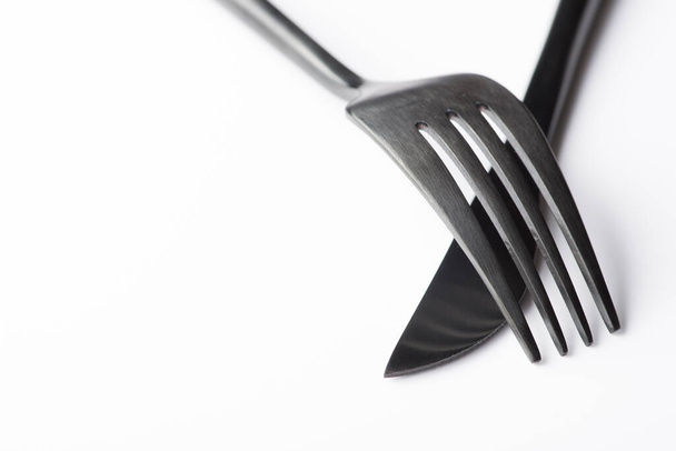 black fork and knife isolated on white background - Zdjęcie, obraz