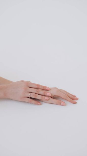 beautiful hand of a girl with a ring on her finger - Fotó, kép