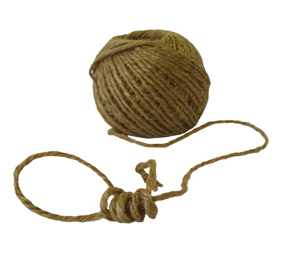 A coil of hemp rope with a loop at the end on a white background - Zdjęcie, obraz