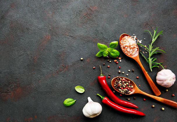 Top view of spices on dark concrete background. Flat lay.  - Foto, Imagen