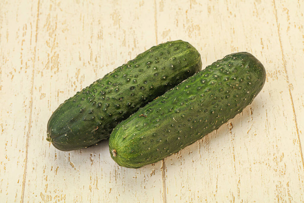 Green fresh two cucumbers over background - Photo, Image